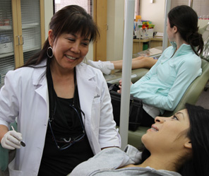 smiling adult woman with teeth model